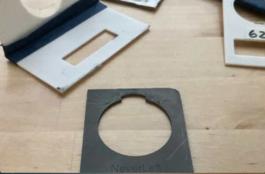 NeverLeft product prototype pieces laid out on a wooden desk